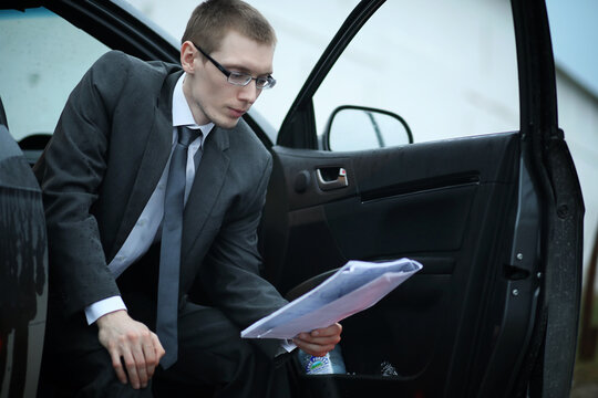 Man in a business suit in the car