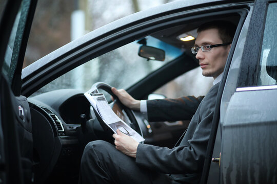Man in a business suit in the car