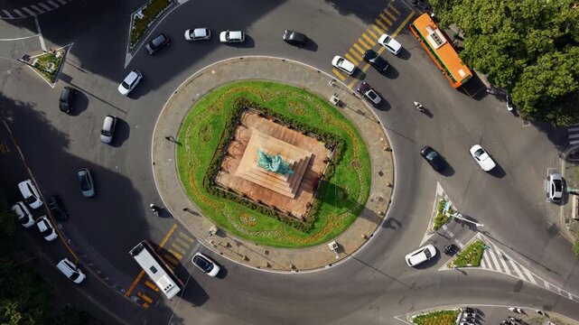 Aerial view of Genoa roundabout with cars, lively urban travel vibe