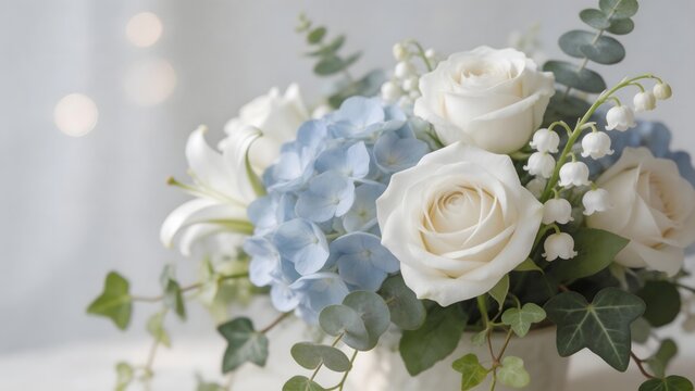 Floral arrangement with white roses and blue hydrangeas