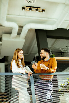 Couple enjoying conversation and coffee in a cozy modern cafe setting