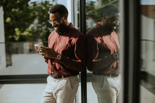 Modern professional enjoying a moment of connection in a stylish urban setting
