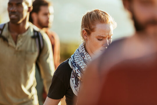 Young adults hiking on a sunny trail