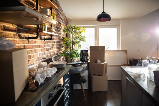 New home moving boxes in modern kitchen