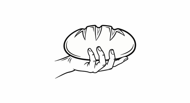 Hand holding a loaf of bread with scoring marks
