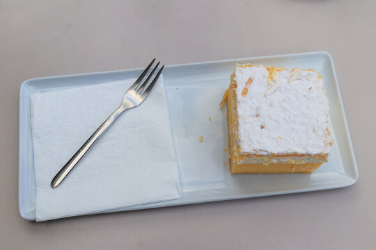 The original Bled cream cake (Cremeschnitte) on white plate. Traditional Slovenian dessert