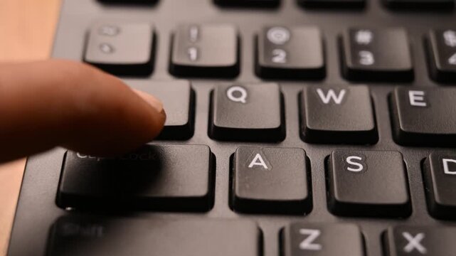 Pressing Caps Lock Key on Keyboard to Toggle Uppercase Typing Mode