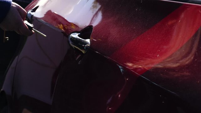 Driver unlocking and opening car door