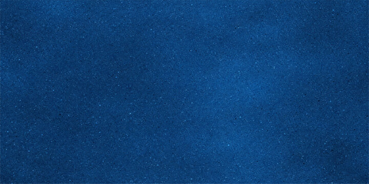 A dark blue denim fabric texture with a rough cotton textile pattern creates a grunge material backdrop suitable for fashion design and clothing wallpaper