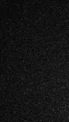 Fototapeta premium A rich black glitter texture fills the frame, creating a luxurious backdrop ideal for branding, invitations, posters, and digital art. Sparkling surface conveys success, and celebration.