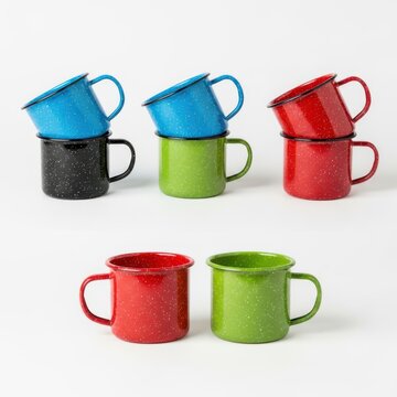 Colorful enamelware camping mugs stacked and displayed together
