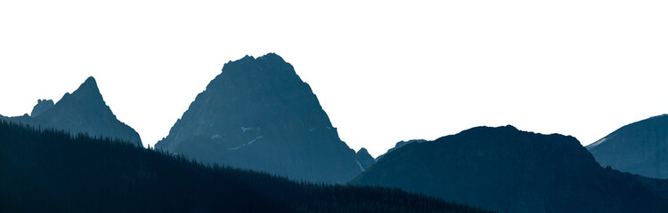 Obraz premium Panorama of blue mountain ranges with a dense forest in the foreground, atmospheric depth and soft natural tones blending into a transparent sky.
