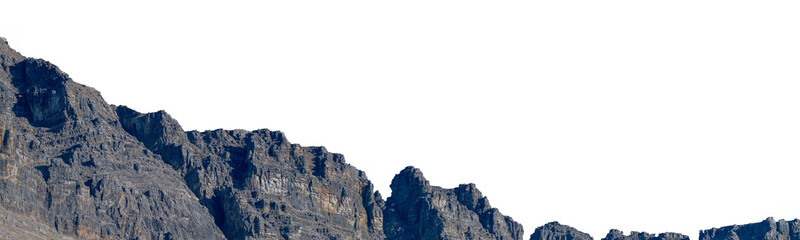 Bleak rocky gray mountain range with rugged terrain and minimal vegetation, dramatic landscape with a transparent sky backdrop. © Craig Taylor Photo
