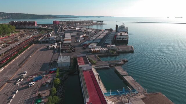 Trieste, Italia 26 Aprile 2026 :Veduta aerea del porto industriale con traghetto DFDS ormeggiato al molo