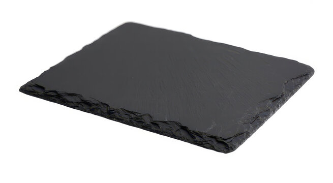 Rectangular black slate stone serving board with rough natural edges on a white background