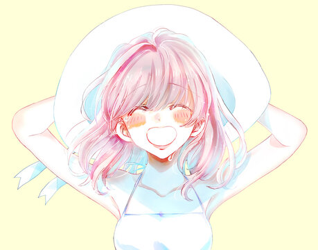 帽子を押さえて笑顔で泣く夏の女性