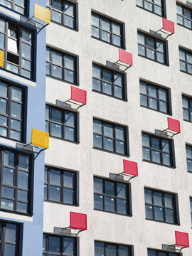 A newly completed high-rise with mounts for outdoor air conditioners on the facade. Awaiting finalization and residents