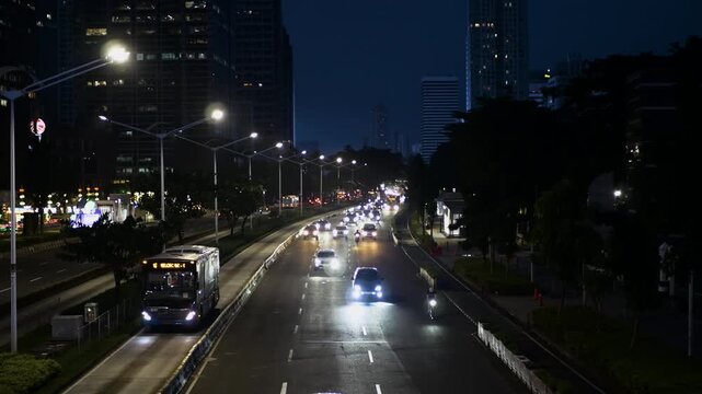 Traffic on Sudirman street, Jakarta, Indonesia in the early morning before sunset
