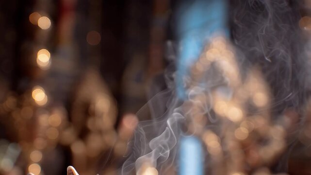 Incense Smoke Rising From Conch Shell During Hindu Worship Ceremony
