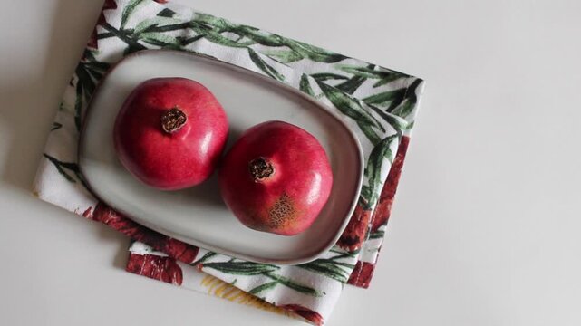 Juicy Pomegranate on Plate Close-Up View