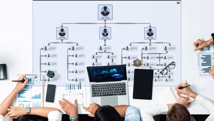 Professional team members analyzing data with charts and graphs on a whiteboard for business planning and collaboration in a modern office environment Sigmoid © InfiniteFlow
