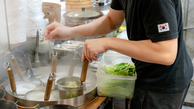 Chef preparing fresh ingredients in a taiwanese kitchen