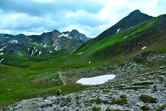 Austrian Alps - view of a tourist on a footpath and the Stuttgarter H&uuml;tte near Lech in the Lechtal Alps