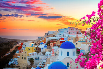 cityscape of Oia, traditional greek village of Santorini, with blue domes of churches at sunset, Greece, toned © neirfy