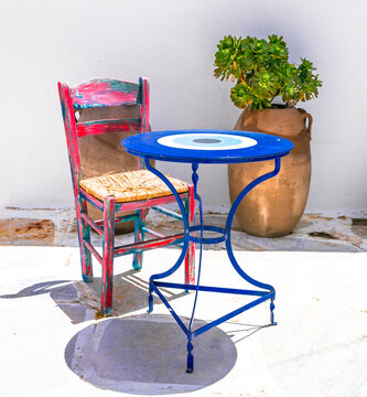Lefkes Paros Greece Aesthetic Close-up, Vintage Pink Wooden Chair and Blue Table with Clay Vase, Traditional Mediterranean Still Life on White Wall Background, Square Composition Travel Decor 4K