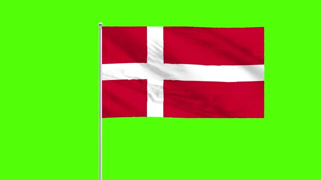 Danish Flag in Motion: The Danish flag, a symbol of heritage and identity, gracefully billows in the wind against a vibrant green backdrop.