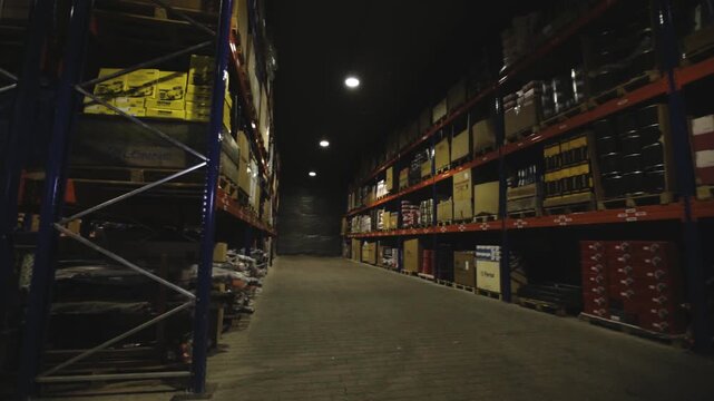 NEW YORK - 5 April 2017: Shoting around basement factory light is turned warehouses machinery business equipment slow motion construction logistic packaging machine box technology job