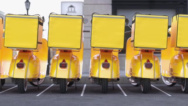 A row of yellow delivery moto scooters with yellow backpacks on a parking. Fast food delivery