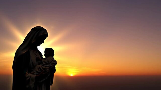 Silhouette of a woman holding a baby with a sun setting in the background. Motherhood and religious devotion.