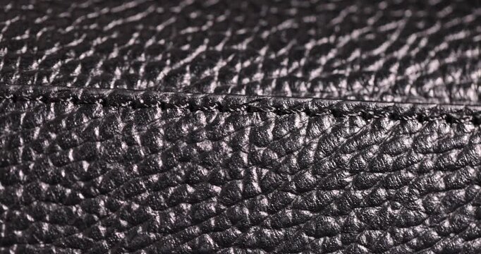 details of a natural   leather bag after prolonged use, details and pieces of natural leather used for the production of items, abstract