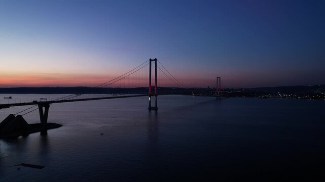 Osmangazi Bridge in Kocaeli, Turkey. Aerial shot with drone. Beautiful sunset landscape. 