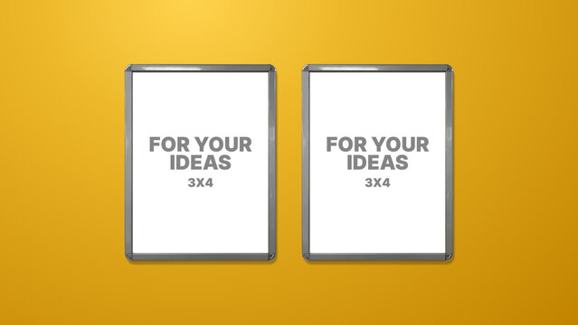 Two blank vertical posters in a silver snap frame, 3x4 format, isolated on vibrant yellow background. Drawing boards. Snap frame.