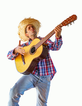 Man dressed for the June festivities singing with a guitar. Isolated