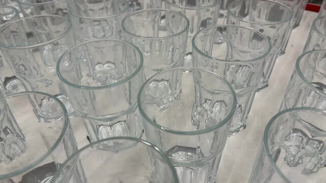 Glass cups arranged in rows creating abstract geometric background