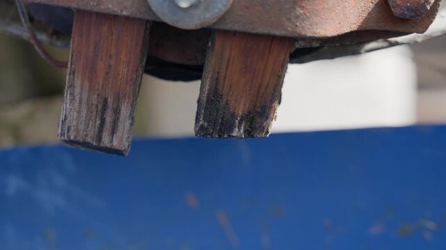 water dripping from pipe close up for leak problem concept with metal outlet and flowing drops