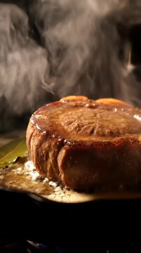 Close up of a glazed meat roast slice on cutting board