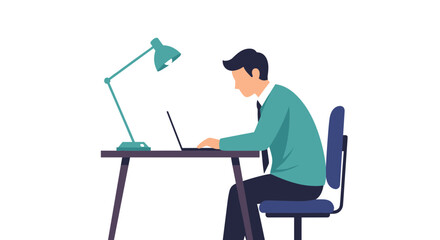 Fototapeta premium A man sits at a desk working on a laptop under a lamp