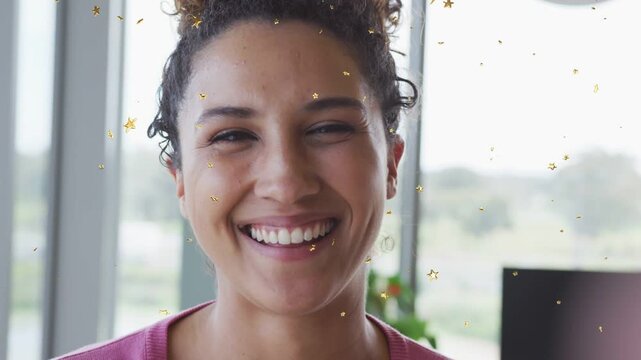 Woman smiling and laughing, touching neck, camera gaze starting gold stars overlay for marketing