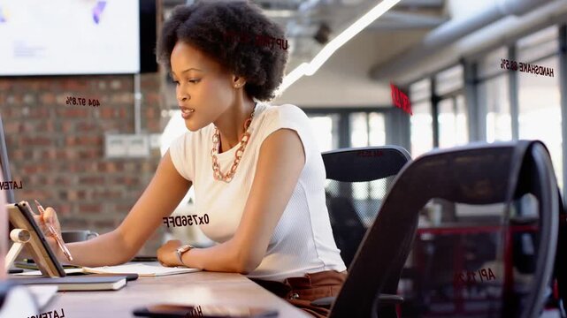Woman leaning at tablet showing red overlay, checking watch, jotting notes, analyzing business data