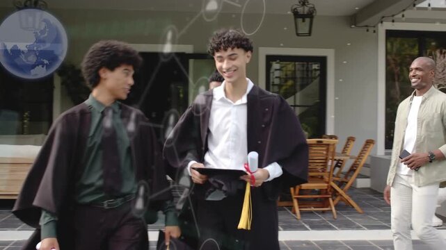 3 grads walking down steps to pool holding diplomas waving caps mentor trailing celebrating grad
