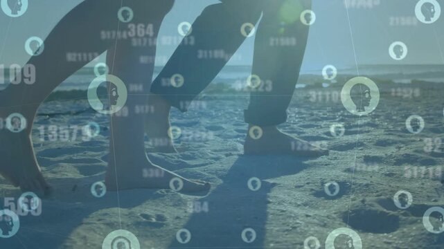 Female and male walking barefoot along shore, HUD marking foot icons starting stride tracking tech