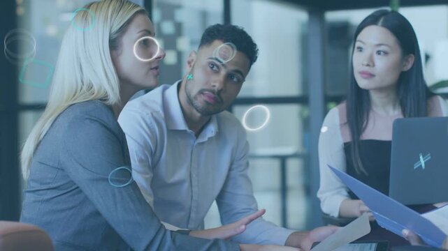 Blonde woman presenting business doc for review, man checking tablet, graphics overlaying scene