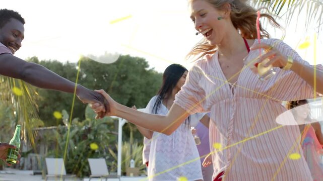 Man in mauve tee taking woman's hand, spinning on travel deck, flares glowing, friends mingling