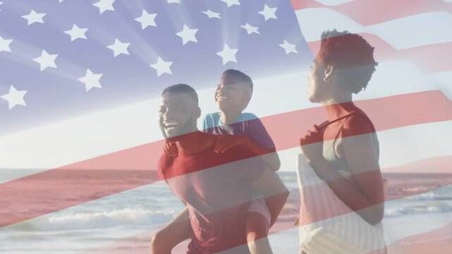 Dad giving child piggyback starting walking along beach beneath flag overlay, tote for marketing