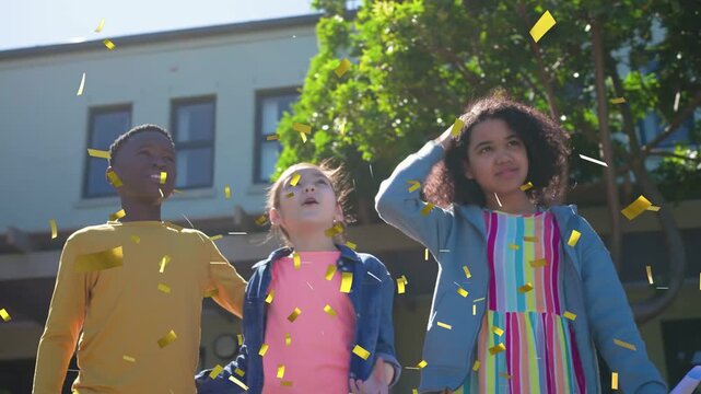 Three children lifting cap, holding diplomas, right child tossing gold confetti, celebrating school