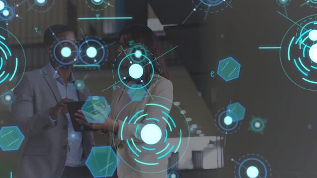 Man holding tablet, woman leaning in office, tapping tablet, HUD showing business data over faces